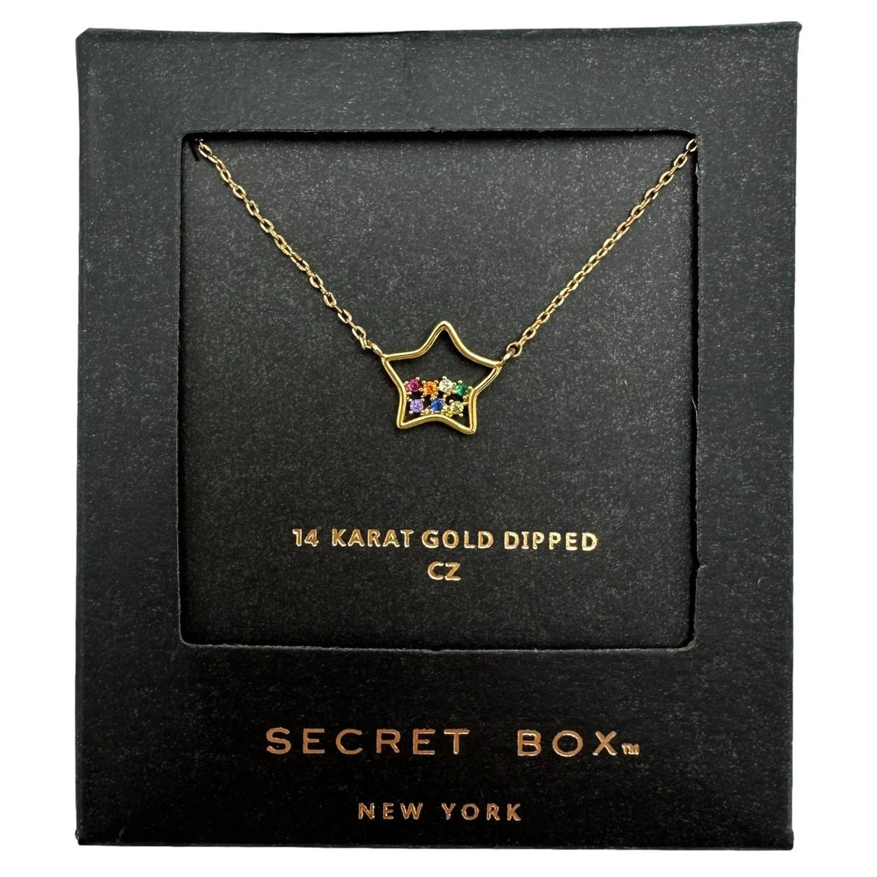 Gold-dipped star necklace with colorful stones in a black box.